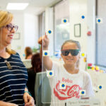 Analeina Lugo works with a space fixator under the guidance of certified optometric vision therapist Beth Houlihan. The space fixator helps determine whether a patient’s eyes see objects as closer or farther than they really are.