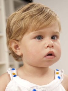 Blonde little girl with white shirt